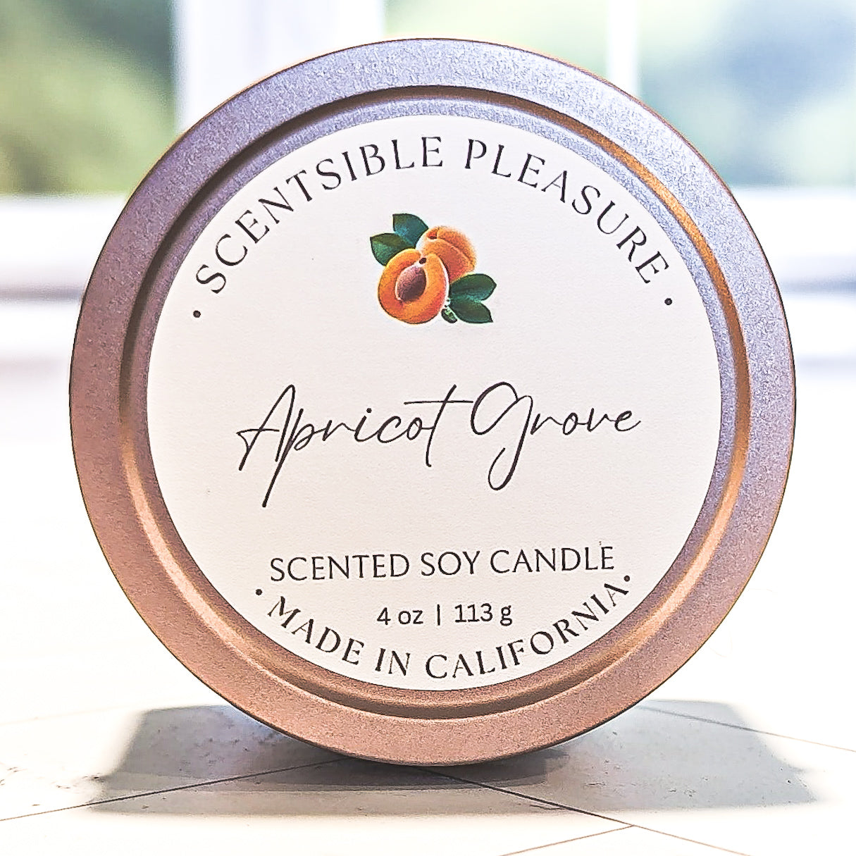 Apricot Grove Scented Soy Candle in 4oz Tin; Spring and Summer Apricot Grove Scented Candle, made with soy wax, with scent notes of Pear, Apricot, and Patchouli